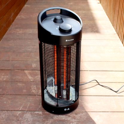 The Blumfeldt Heat Guru 360 patio heater on wooden decking
