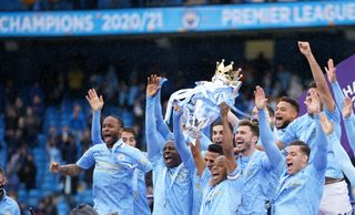 Manchester City’s Fernandinho lifts the Premier League trophy last season