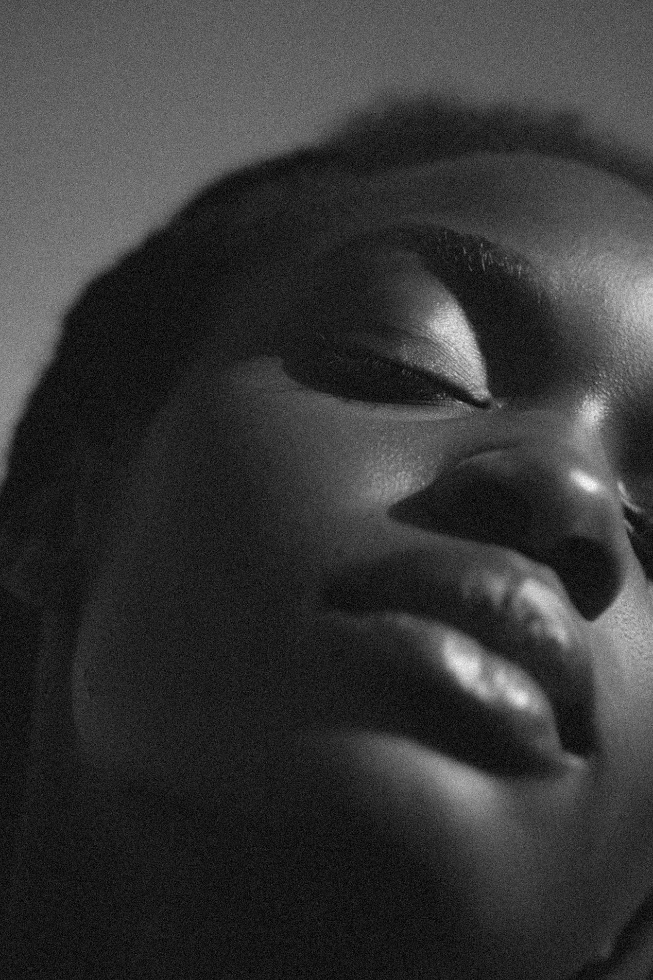 An intimate portrait shot of a model with her eyes closed