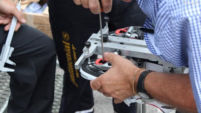 Then a new pair of shoes are clipped into the pedals, and once all the reference points line up, the cleats are tightened down