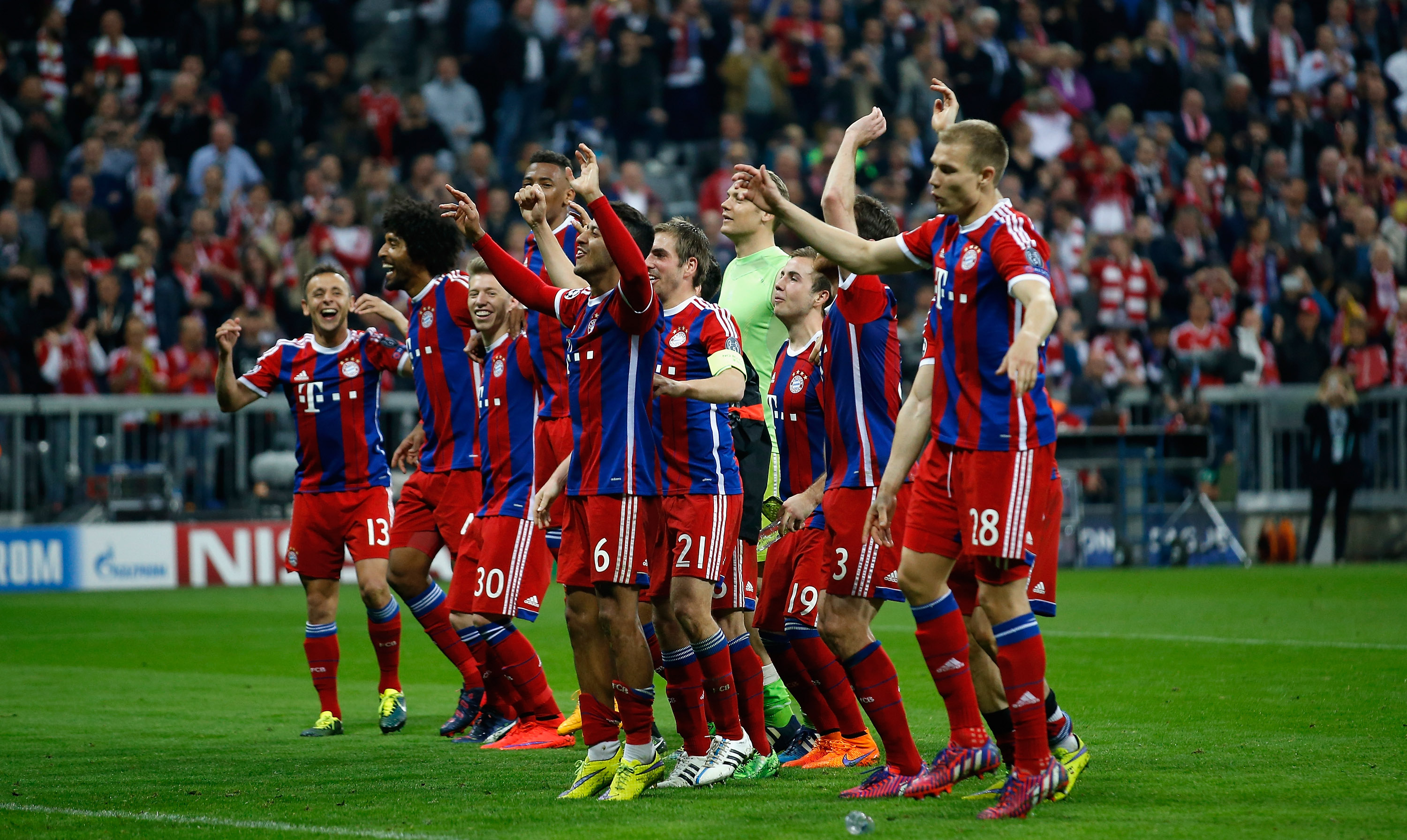 Bayern Munich players celebrate with their fans after victory over Porto in the Champions League quarter-finals in April 2015.