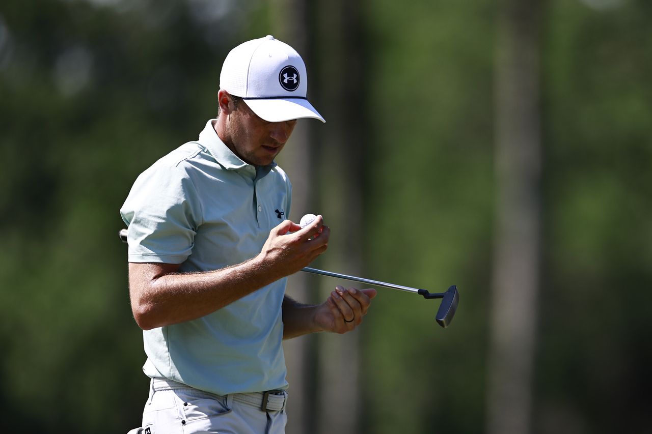 Jordan Spieth looks at his ball on the sixth green during the second round of the Cadillac Championship