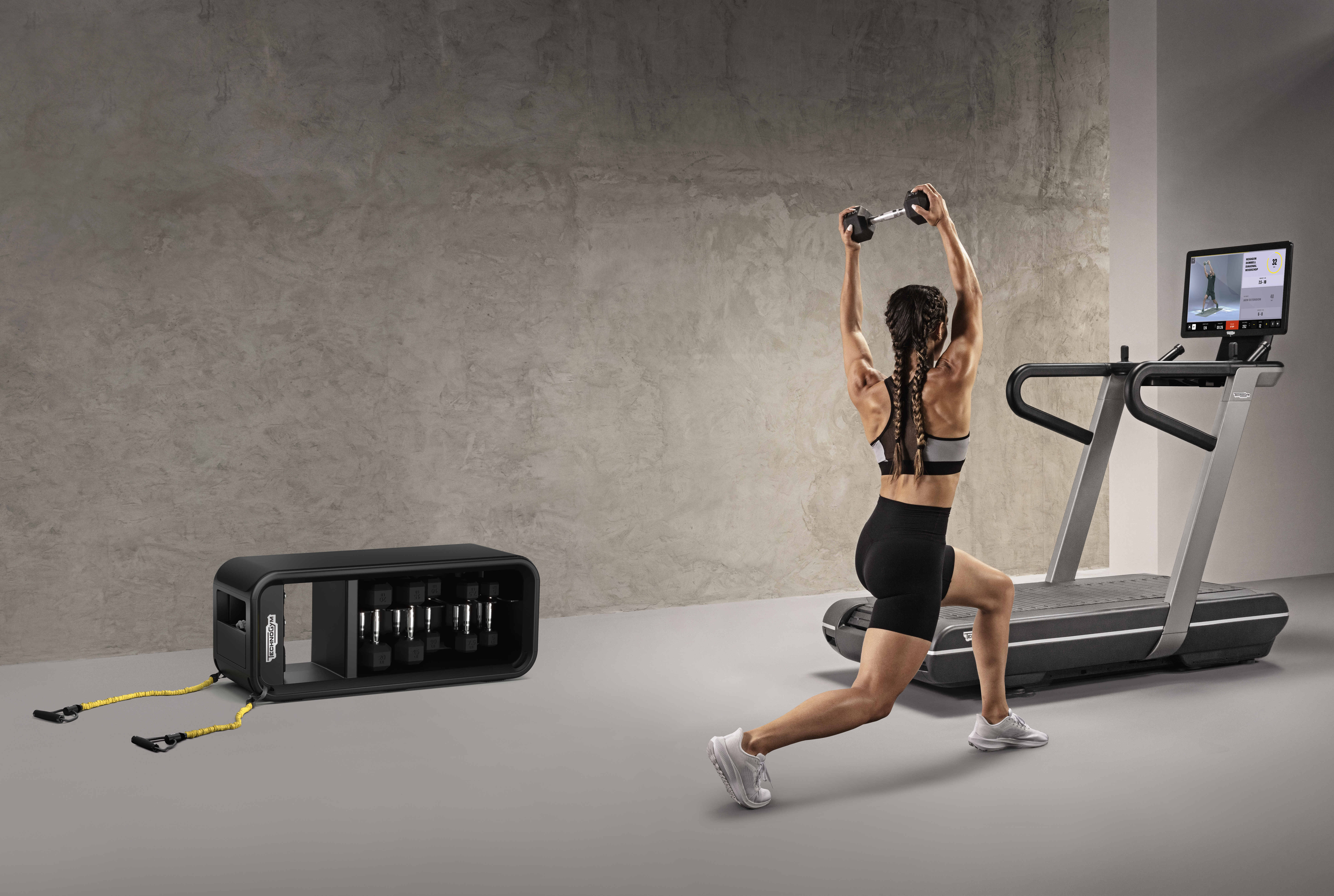 Woman exercising with Technogym equipment