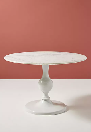 White decorative base dining table.