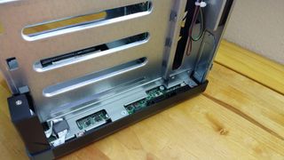 Adding a PCIe expansion card is as simple as removing the cover (held in place with three screws) and slotting it in. 
