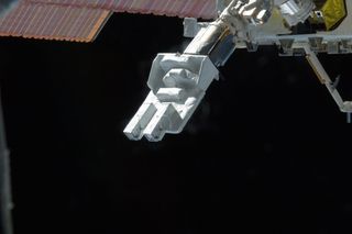 Small Satellite Orbital Deployer (SSOD) attached to the Japanese module's robotic arm is featured in this image photographed by an Expedition 33 crew member on the International Space Station. Several tiny satellites were released outside the Kibo laboratory using the SSOD on Oct. 4, 2012.