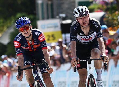 SANTA MARIA IN CALANCA, SWITZERLAND - JUNE 19: (L-R) Oscar Onley of Great Britain and Team Picnic PostNL reacts as stage winner ahead of Joao Almeida of Portugal and UAE Team Emirates - XRG - Black Points Jersey during the 88th Tour de Suisse, Stage 5 a 183.8km stage from La Punt to Santa Maria in Calanca 941m / #UCIWT / on June 19, 2025 in Santa Maria in Calanca, Switzerland. (Photo by Tim de Waele/Getty Images)