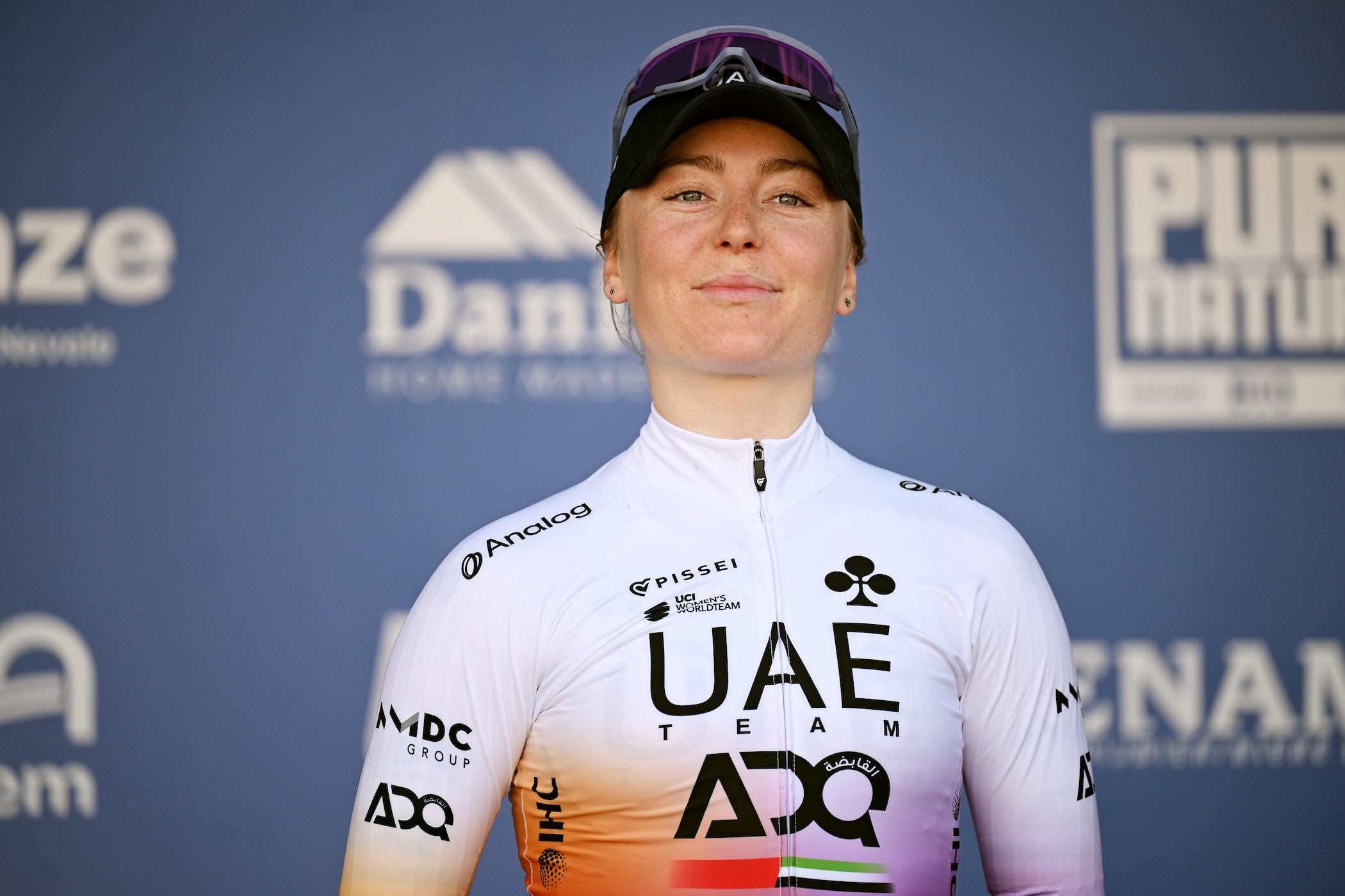 NOKERE, BELGIUM - MARCH 18: Lara Gillespie of Ireland and UAE Team ADQ on third place poses on the podium ceremony after the 7th Danilith Nokere Koerse 2026, Women's Elite a 133.3km one day race from Deinze to Nokere / #UCIWWT / on March 18, 2026 in Nokere, Belgium. (Photo by Luc Claessen/Getty Images)