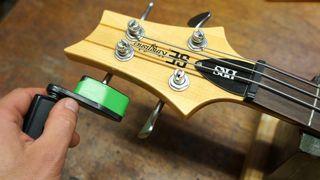 Using a string winder to remove bass guitar strings