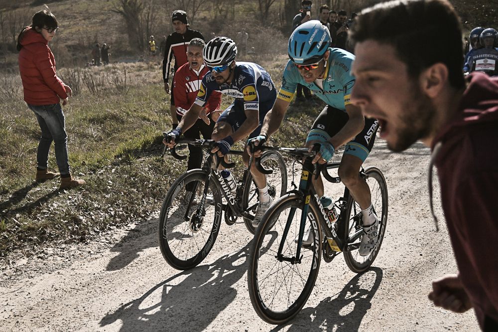 Julian Alaphlippe and Jakob Fuglsang ride to the finish of Strade Bianche