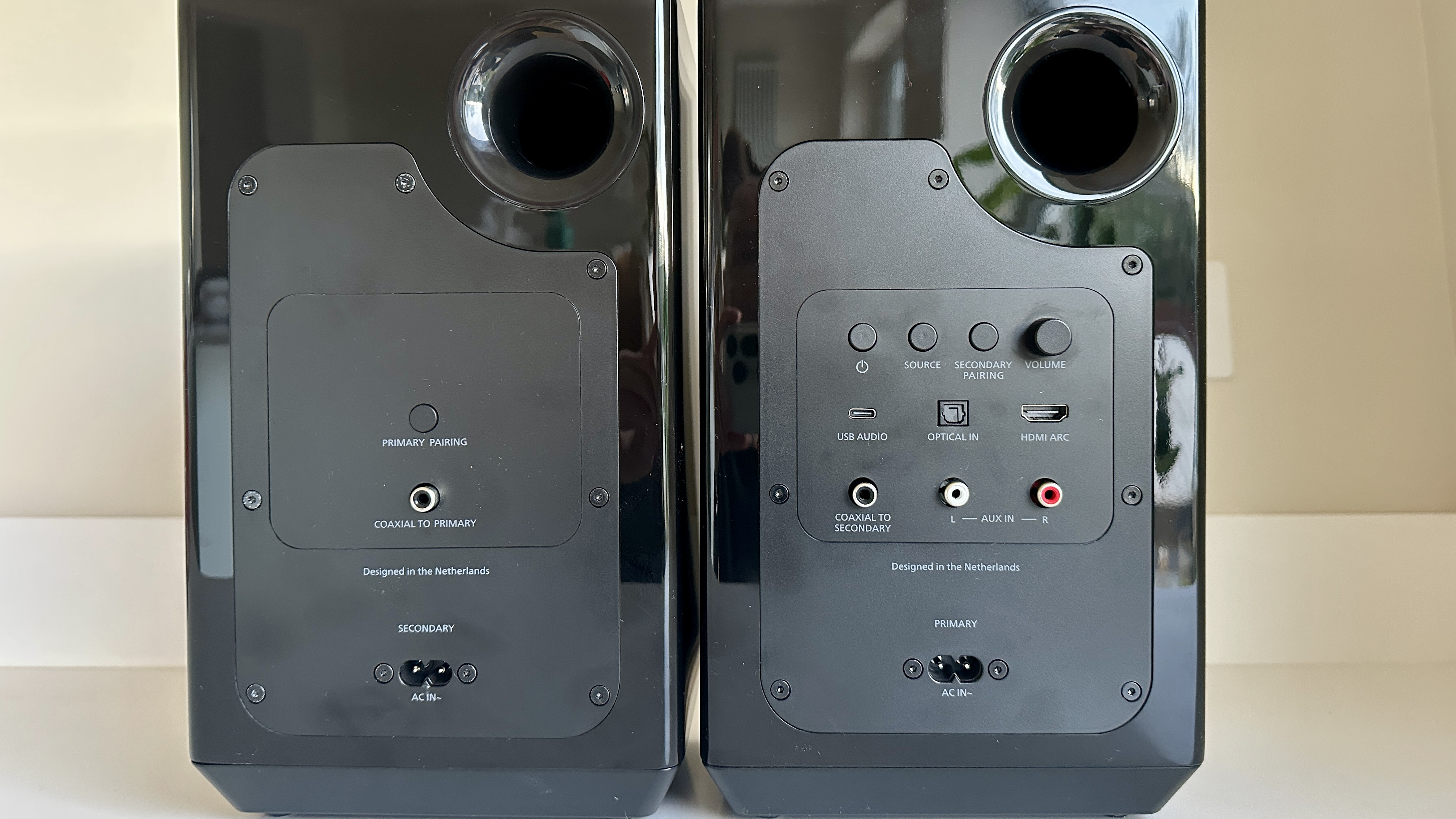 The two Philips Fidelio FA3 speakers viewed from the back, showing connections and bass reflex ports