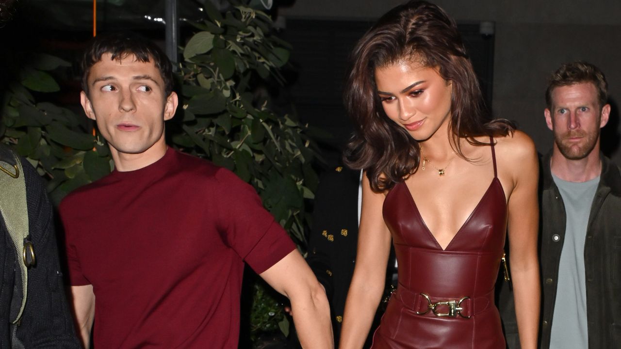 Zendaya and Tom Holland match in burgundy outfits for a Bero event on Oct. 24