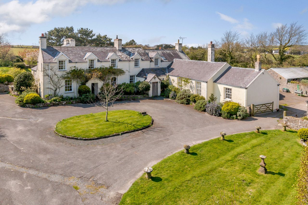 Hayston Farmhouse in Pembrokeshire is a stunning four-bedroom property with a one-bedroom courthouse, surrounded by gardens filled with pollinator-friendly plants. For sale through Savills for £700,000.