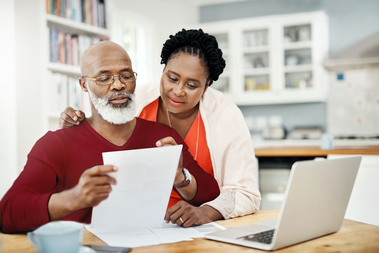 A couple looking at paperwork together 