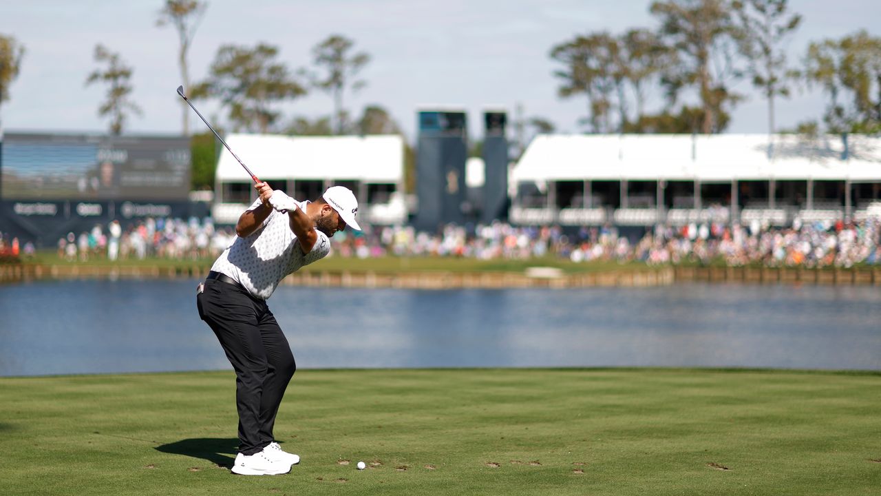 Jon Rahm at the top of his backswing on the 17th at TPC Sawgrass