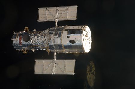 An STS-125 crewmember onboard the space shuttle Atlantis snapped a still photo of the Hubble Space Telescope as the two spacecraft approached each other in Earth orbit prior to the capture of the giant observatory on May 13, 2009.