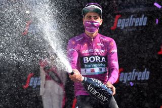 MILAN ITALY MAY 30 Peter Sagan of Slovakia and Team Bora Hansgrohe Purple Points Jersey celebrates at podium during the 104th Giro dItalia 2021 Stage 21 a 303km Individual Time Trial stage from Senago to Milano Champagne ITT UCIworldtour girodiitalia Giro on May 30 2021 in Milan Italy Photo by Stuart FranklinGetty Images