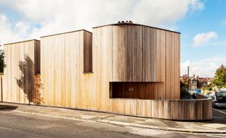 A contemporary cedar clad house, utilising every inch of a tight corner plot in London