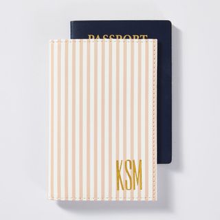 A striped Fillmore passport cover made of vegan leather by Mark & Graham