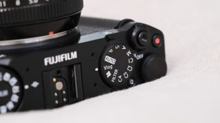 Close up of the mode dial on a Fujifilm X-M5 camera