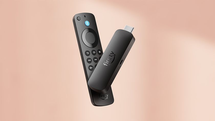 Amazon Fire TV Stick 4K Select on a salmon pink background
