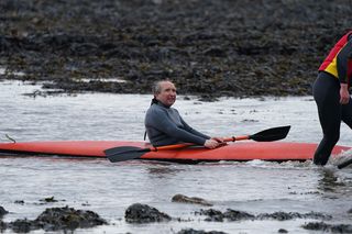 Eddie Marsan as John Darwin getting advice on filming in a canoe..