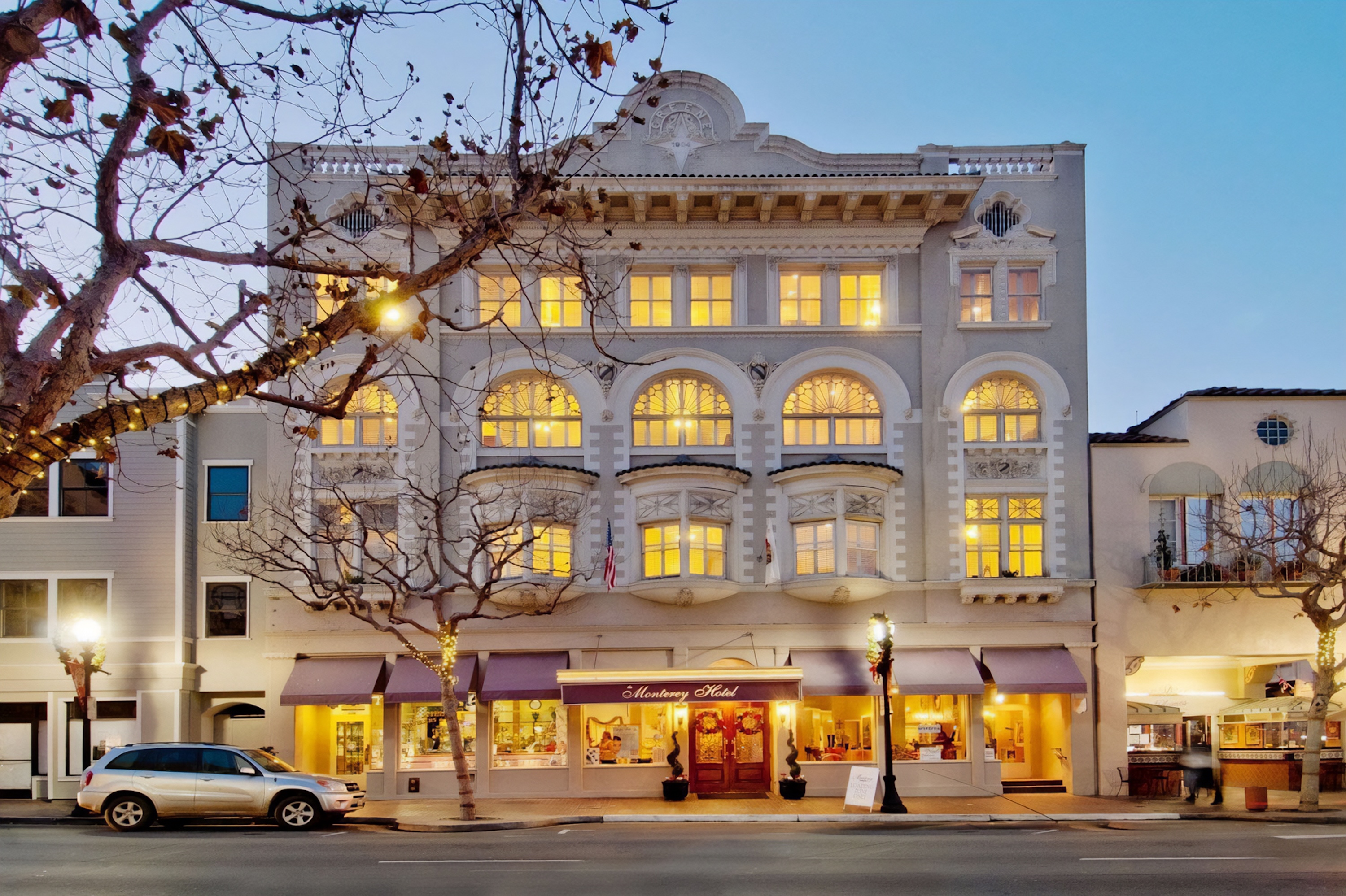 The exterior of the Monterey Hotel at dusk