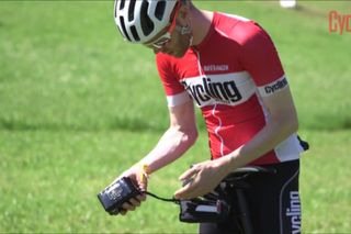 Ebike battery is shown here in a rider's hands.