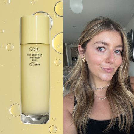 samantha holender taking a selfie on a yellow background next to a bottle of oribe hair alchemy elixir