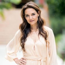 Katie Holmes in a cream colored dress