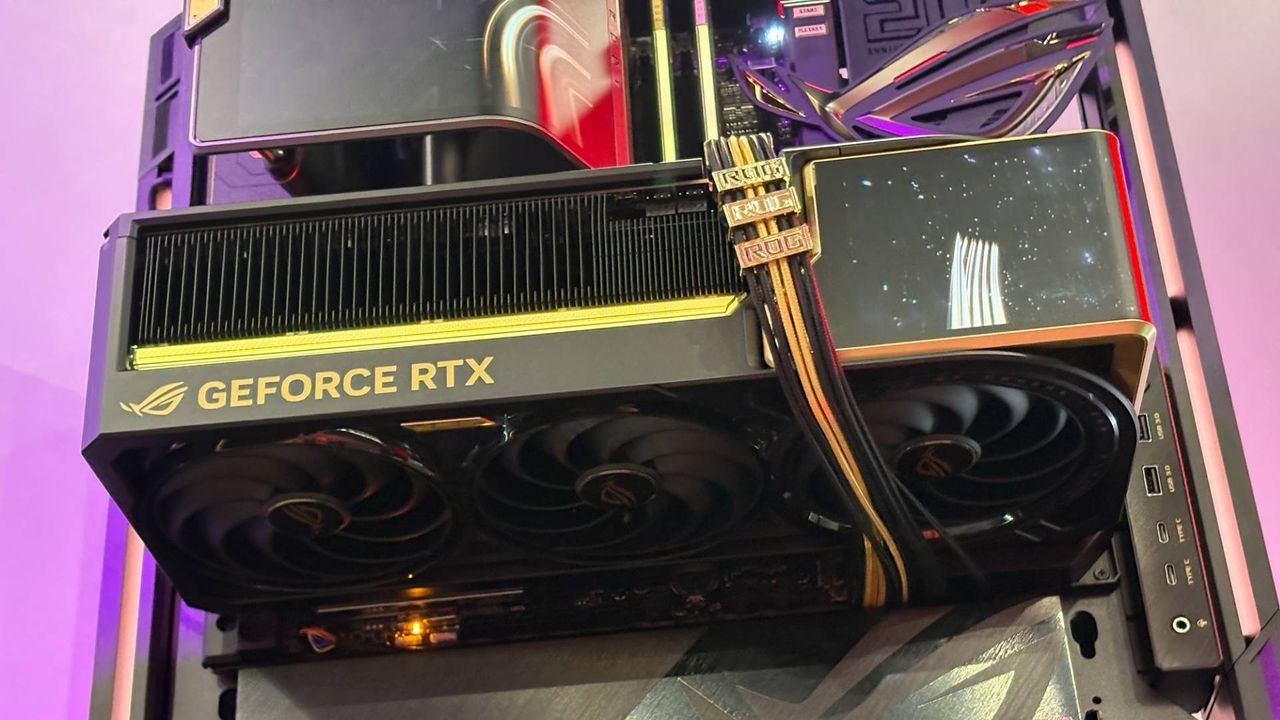 The ROG Astral GeForce RTX 5090 Edition 20 is seen mounted on the open-frame ROG GR20 PC case on the showfloor of Computex 2026.