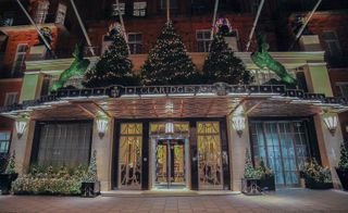 Exterior of Claridge's with Christmas lights and trees