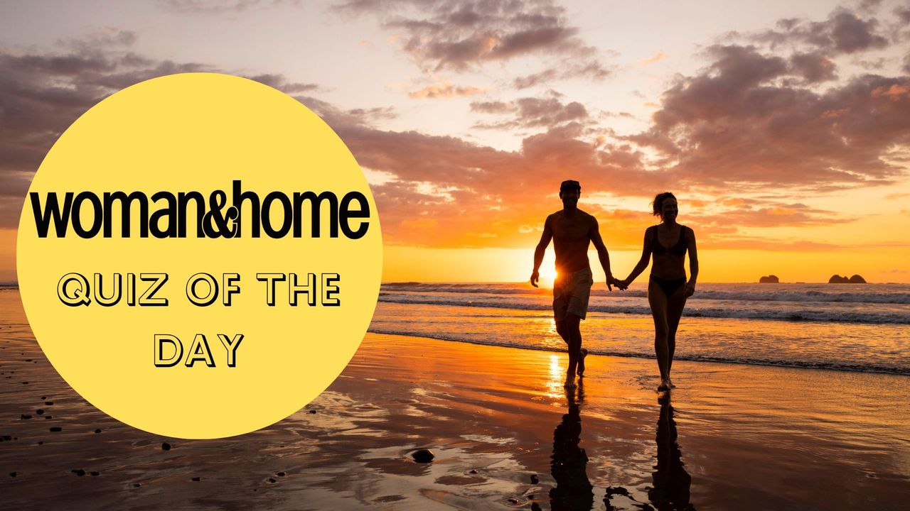 A couple hold hands at sunset on a beach, with a &#039;woman&amp;home quiz of the day&#039; badge overlaid