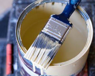 paint brush on a paint pot