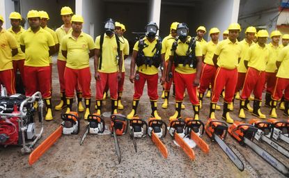 Indian first responders prepare to clean up a cyclone