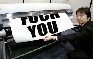 A printer printing out the message 'fuck you'