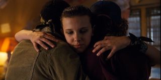 Eleven hugging Dustin and Lucas