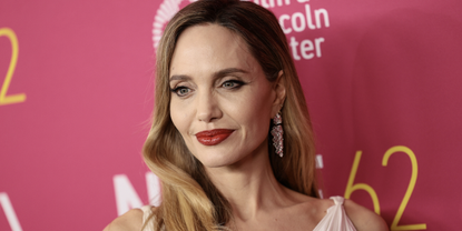 Angelina Jolie attends the &quot;Maria&quot; screening during the 62nd New York Film Festival at Alice Tully Hall, Lincoln Center on September 29, 2024 in New York City wearing a white pleated dress