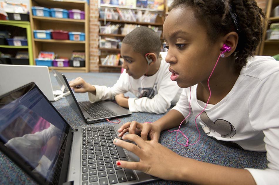 Kids using broadband in school