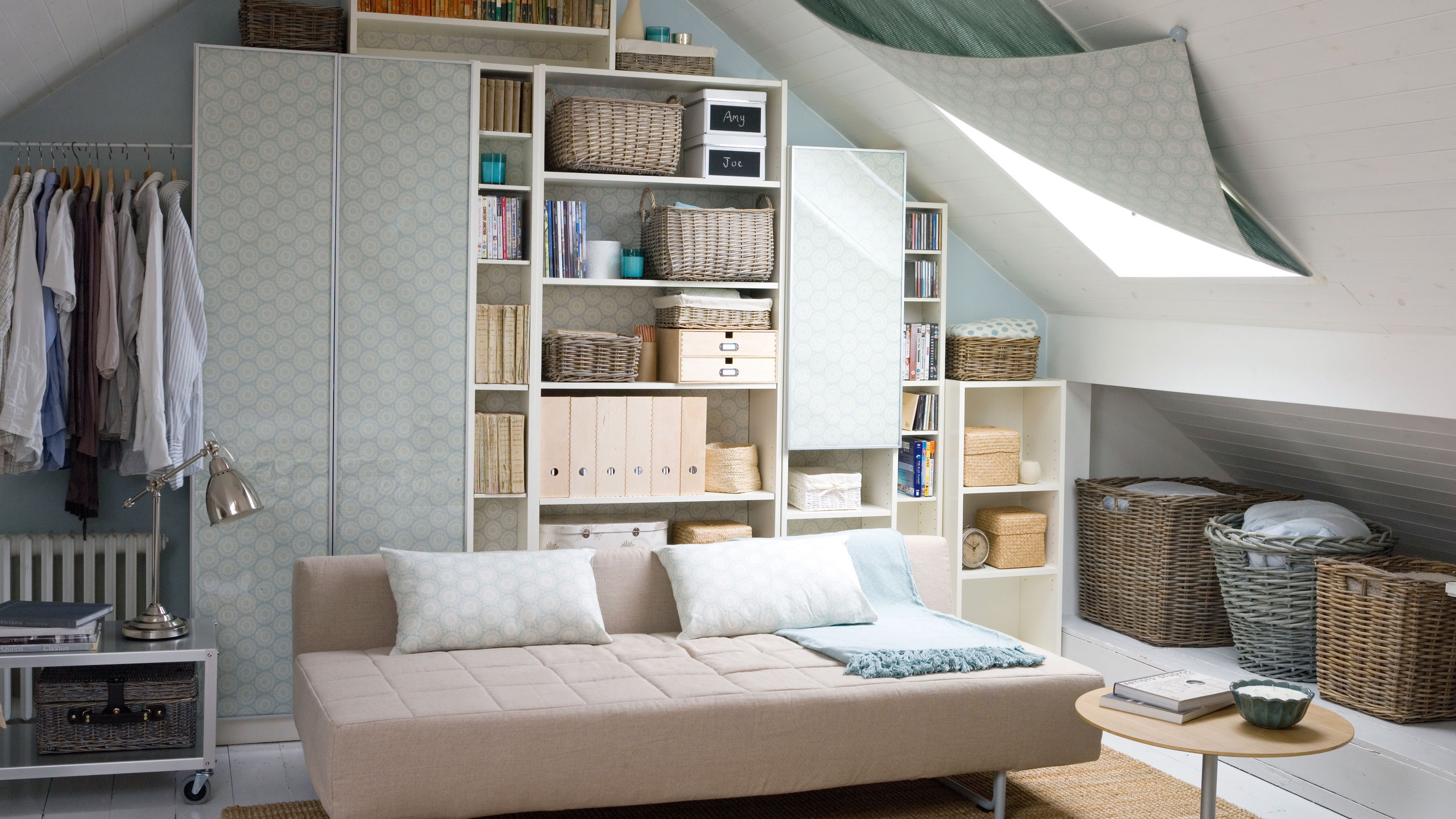 Loft room with sofa bed and black out blind