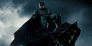 Ben Affleck as Batman standing on stone gargoyle in Justice League