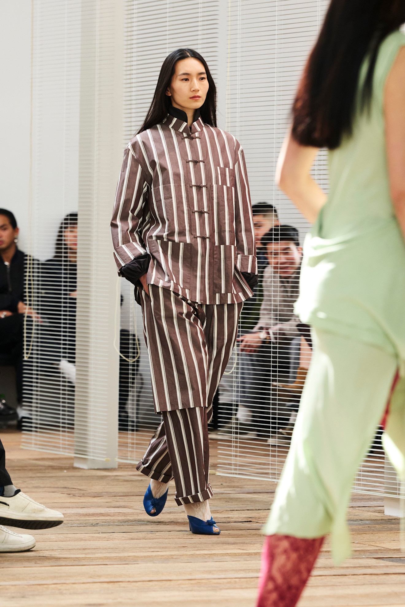 Gui Yang fall/winter 25 runway imagery striped tang jacket