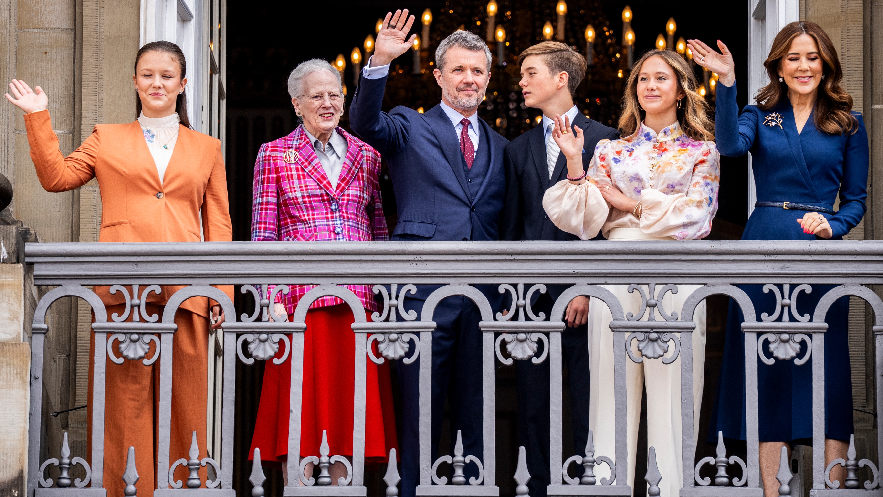King Frederik X of Denmark (C), Queen Mary of Denmark (R), Princess Isabella of Denmark, Queen Margrethe of Denmark (2ndL), Prince Vincent of Denmark (C-R), and Princess Josephine of Denmark wave from the balcony at Frederik VIII's Palace