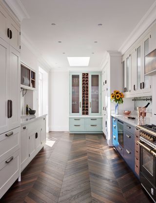 Galley kitchen with parquet painted cabinet