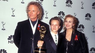 Luke, Lucky and Laura stand with an Emmy for General Hospital in the '90s. Anthony Geary, Joshua Jackson, Genie Francis.