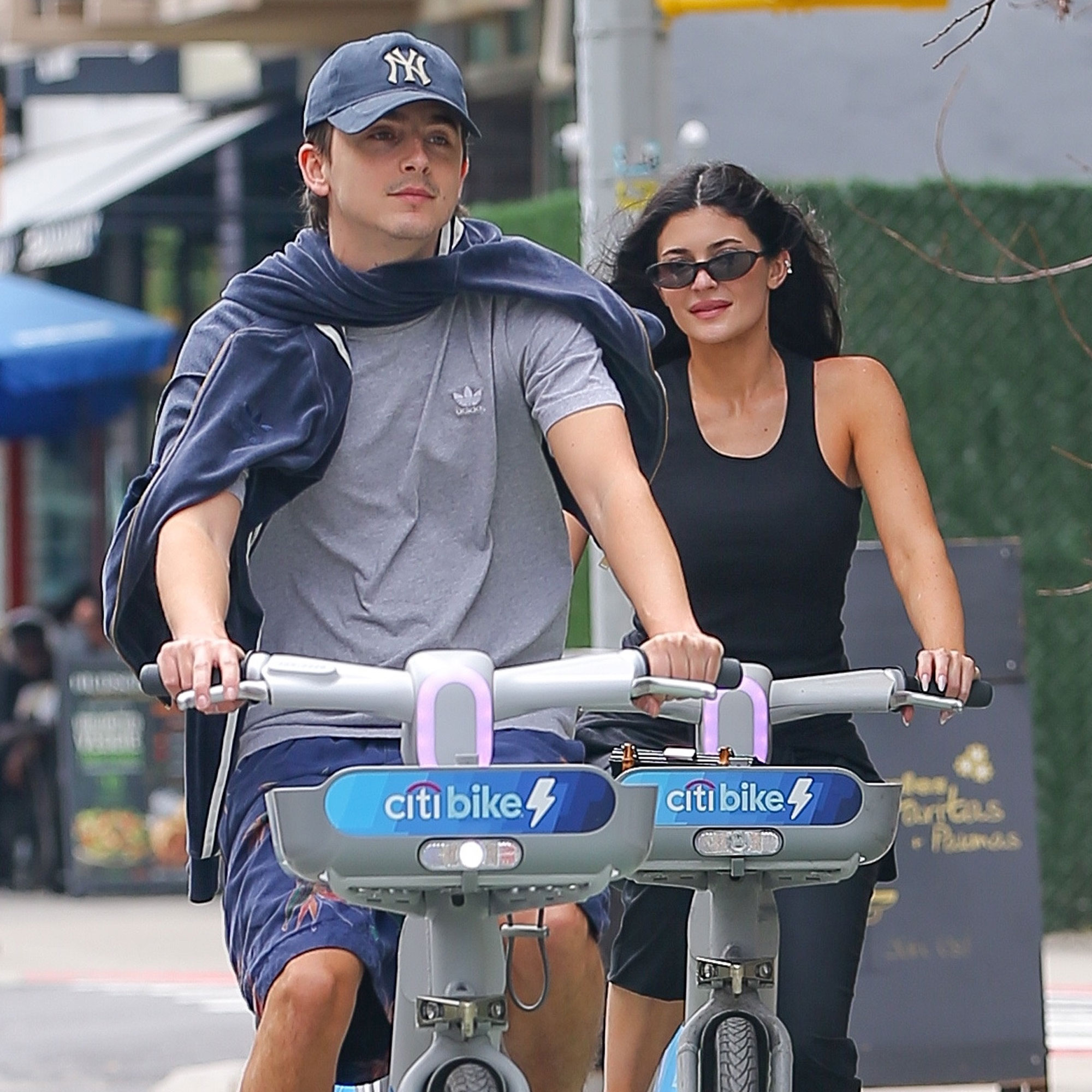 Kylie Jenner wears Maison Margiela Tabi Ballerina Flats on a Citi Bike with Timothee Chalamet