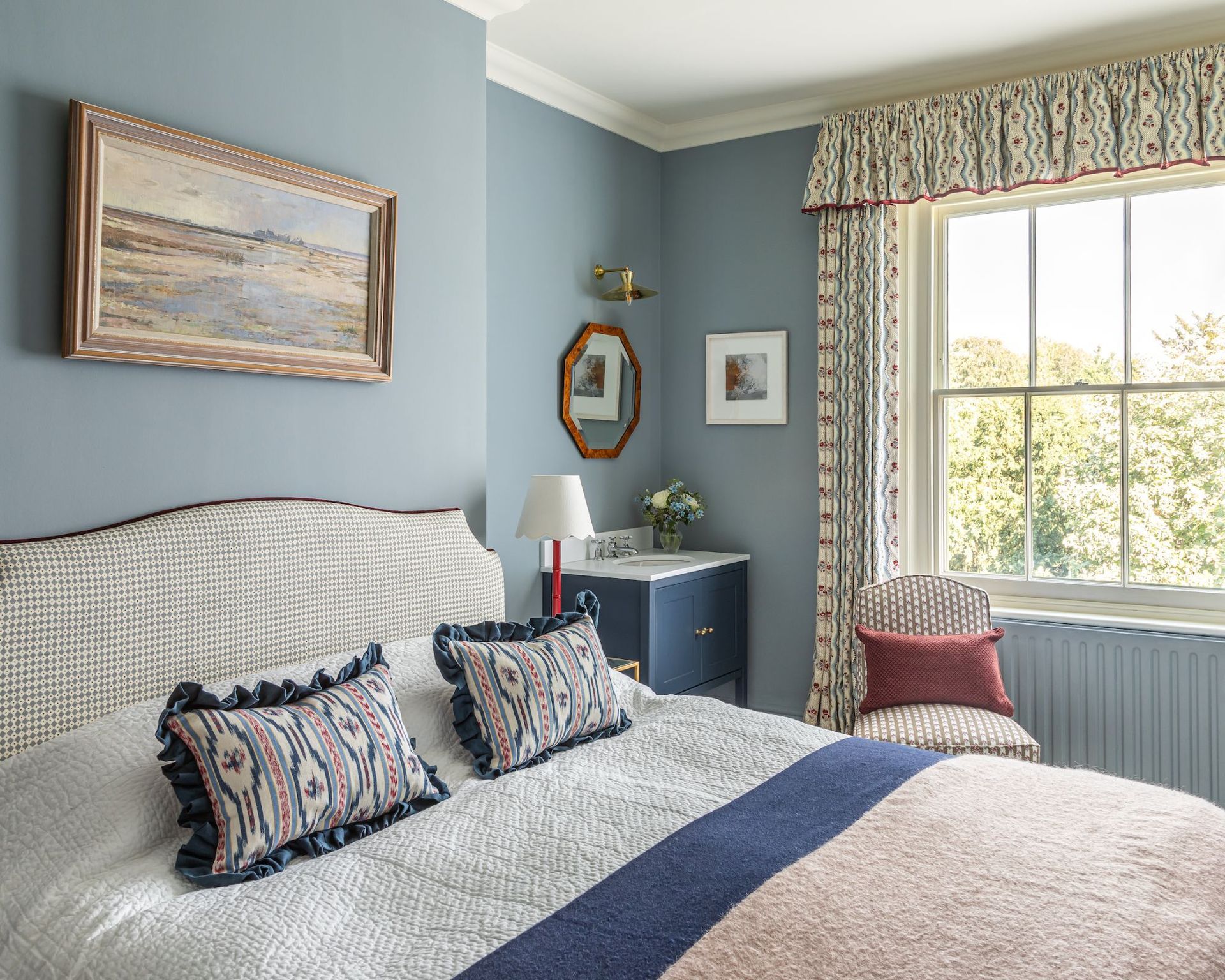 A traditional bedroom with baby blue walls