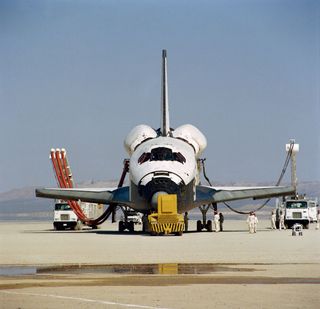 This head-on photograph of NASA's space shuttle Columbia was taken during post-landing servicing on Rogers dry lake bed at Edwards Air Force Base in southern California. The STS-1 mission ended earlier today, two and one third days later and thousands of 