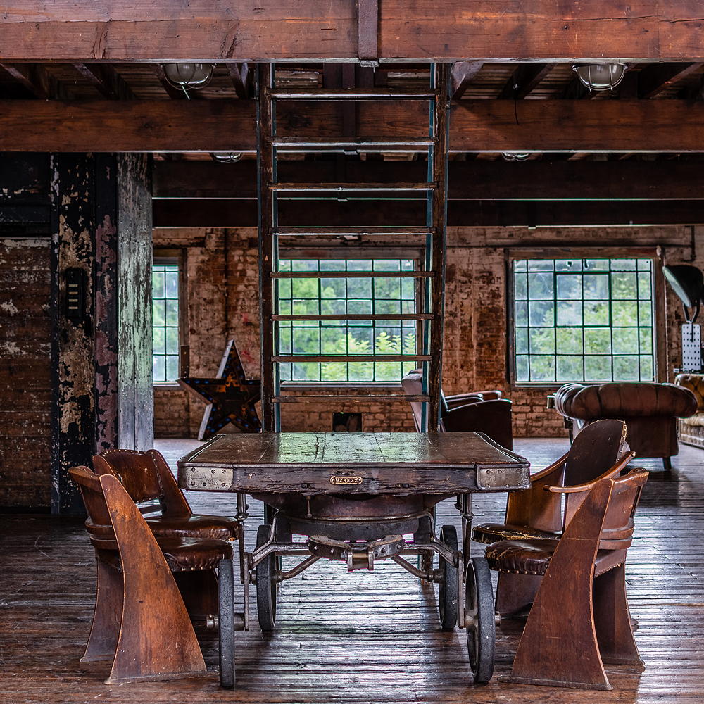 warehouse with dining table with wheels and chairs