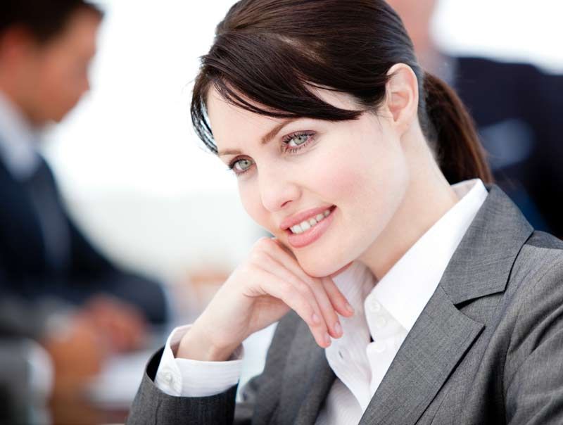 Assertive businesswoman in a meeting with her team 